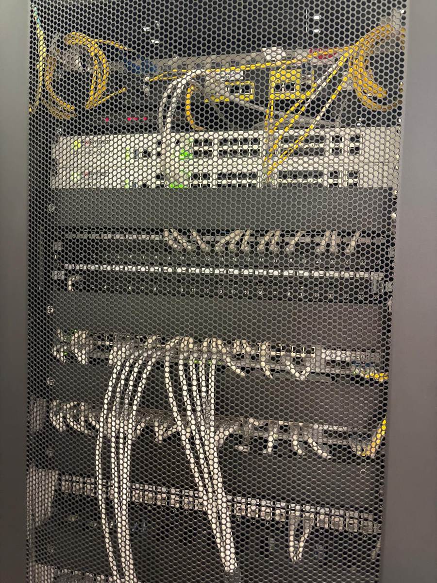Network and security equipment rack installed in a residential building service room
