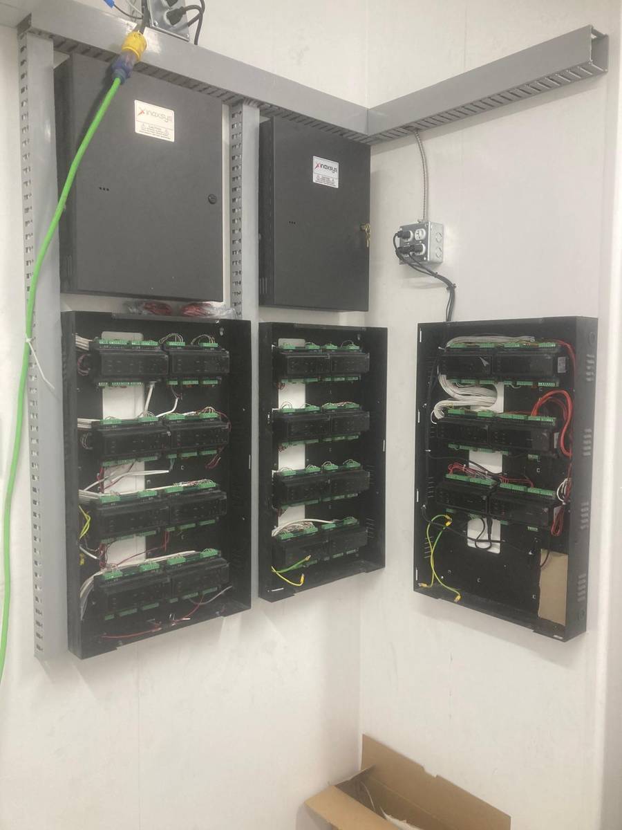 Access control and alarm panels installed in a commercial building service room